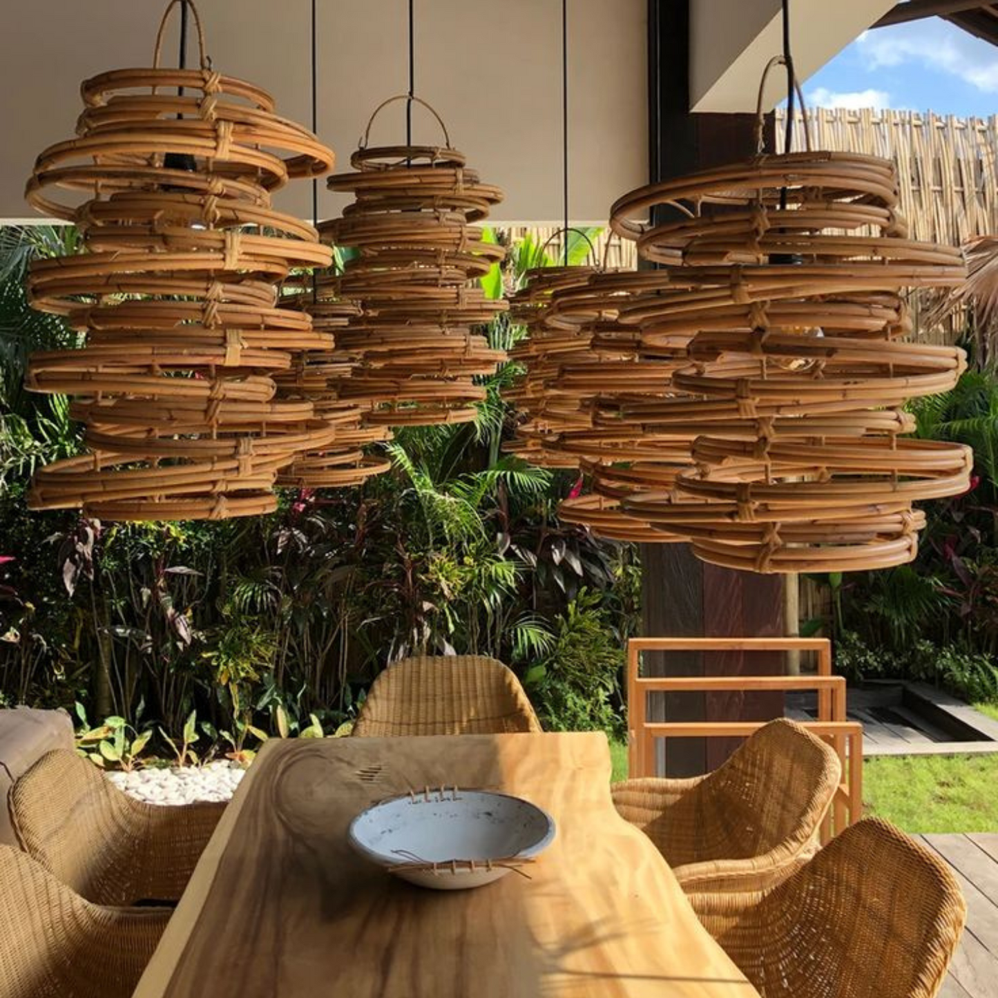 Handcrafted Layered Rattan Pendant Light.